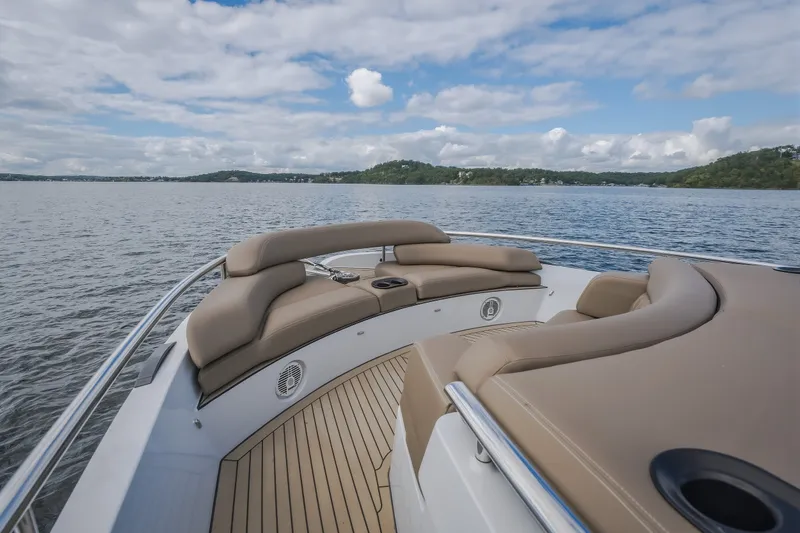 Slide: The Image of Luxurious 2022 Steeler Bronson 50 yacht with plush seating on a serene lake. - 48