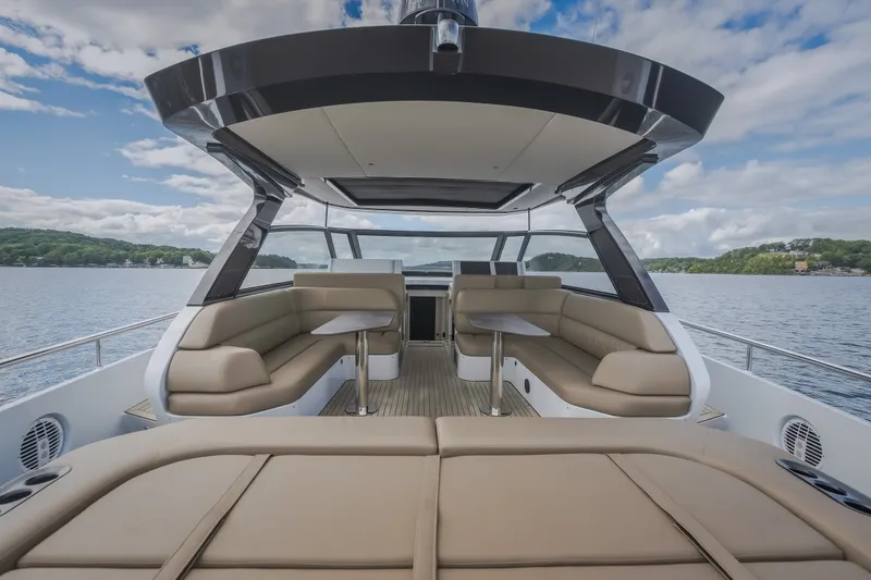 Slide: The Image of Luxurious 2022 Steeler Bronson 50 yacht interior with plush seating and scenic water view. - 25