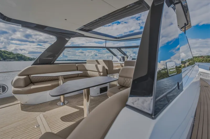 Slide: The Image of Luxurious 2022 Steeler Bronson 50 yacht interior with elegant seating and scenic water views. - 41