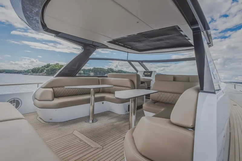 Slide: The Image of Luxurious 2022 Steeler Bronson 50 yacht interior with elegant seating and scenic water view. - 23