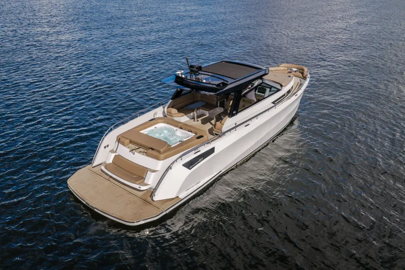 Slide: The Image of Luxury 2022 Steeler Bronson 50 yacht with jacuzzi, cruising on open water. - 10