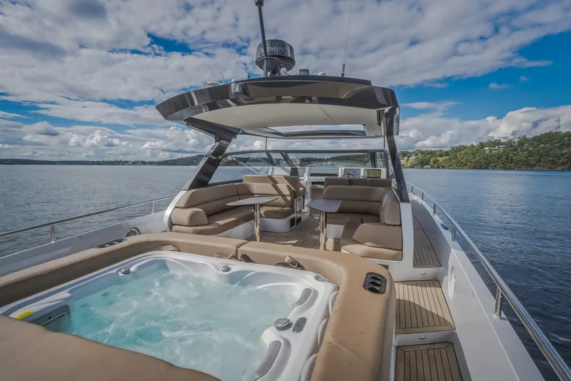 Slide: The Image of Luxury Steeler Bronson 50 yacht with jacuzzi, cruising on a serene lake, 2022 model. - 40