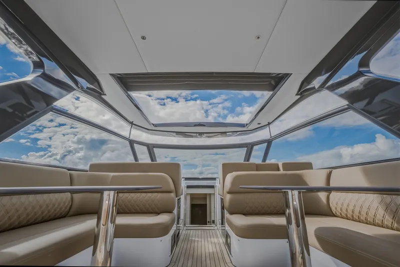 Slide: The Image of Luxurious interior of 2022 Steeler Bronson 50 yacht with panoramic windows and plush seating. - 32