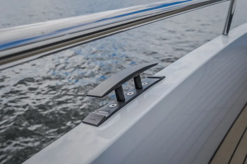 Slide: The Image of Close-up of a 2022 Steeler Bronson 50 yacht cleat against water backdrop. - 46
