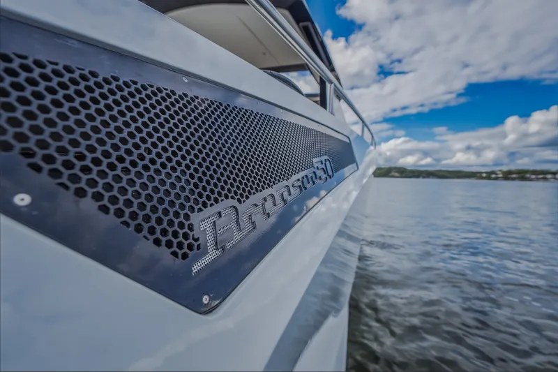 Slide: The Image of 2022 Steeler Bronson 50 yacht on water, showcasing sleek design and branding. - 36