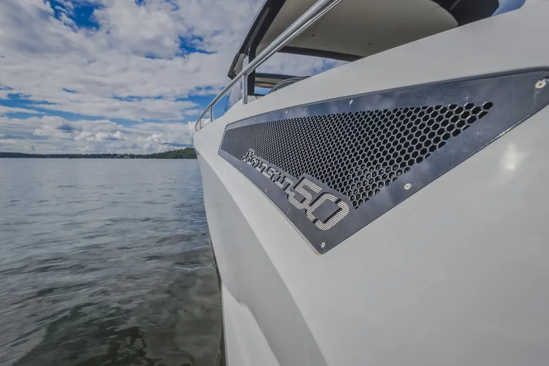 Slide: The Image of 2022 Steeler Bronson 50 yacht on calm water under a cloudy sky. - 37