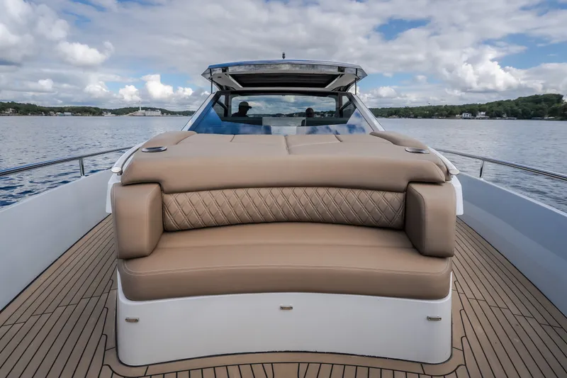Slide: The Image of Luxurious Steeler Bronson 50 yacht deck with plush seating, 2022 model, on serene waters. - 52
