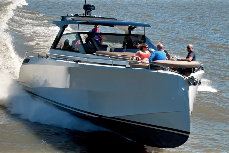 Slide: The Image of 2022 Steeler Bronzon 50 yacht cruising on open water with passengers onboard. - 6