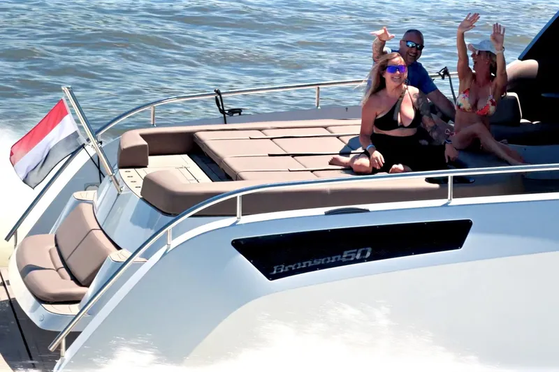 Slide: The Image of Three people enjoying a ride on a 2022 Steeler Bronzon 50 yacht. - 7