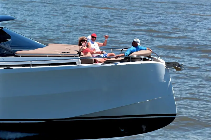 Slide: The Image of People relaxing on a 2022 Steeler Bronzon 50 yacht in open water. - 9
