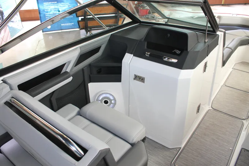 Slide: The Image of 2023 Cobalt R8 boat interior with sleek seating and modern dashboard design. - 16