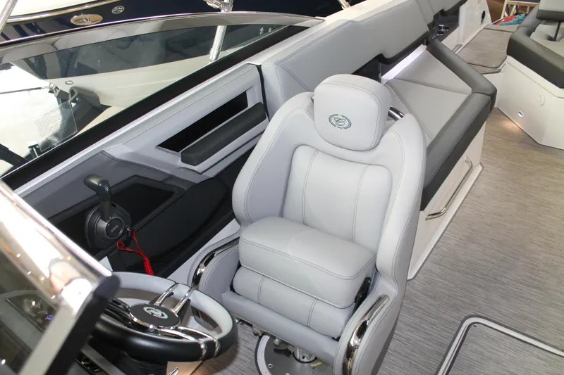 Slide: The Image of 2023 Cobalt R8 boat interior with luxurious seating and modern steering controls. - 20