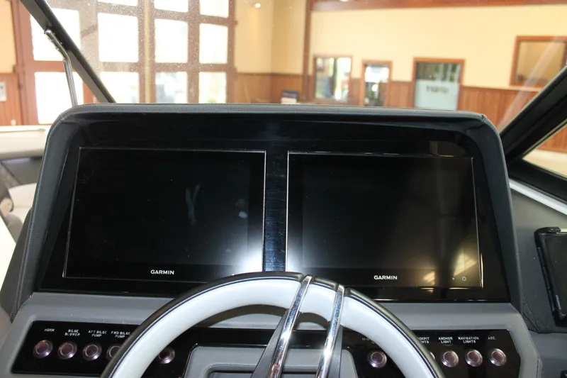 Slide: The Image of 2023 Cobalt R8 dashboard with dual Garmin displays and steering wheel. - 21