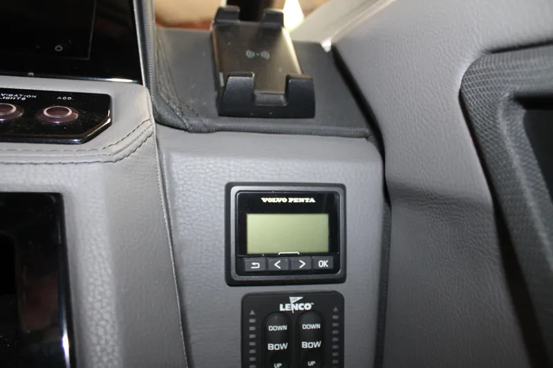 Slide: The Image of Dashboard controls of 2023 Cobalt R8 boat featuring Volvo Penta and Lenco systems. - 25