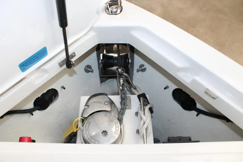 Slide: The Image of Anchor compartment of 2023 Cobalt R8 boat with winch and chain. - 29
