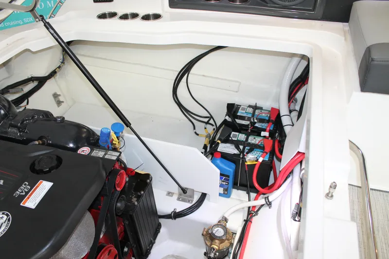 Slide: The Image of Engine compartment of a 2023 Cobalt R8 boat, featuring batteries and wiring. - 35