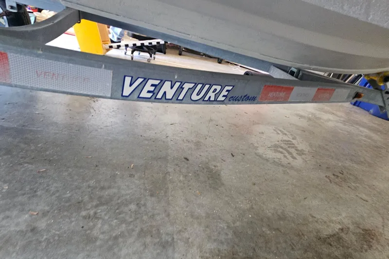 Slide: The Image of Trailer for 2014 Zodiac Yachtline 2 Deluxe 380, featuring Venture Custom branding. - 13