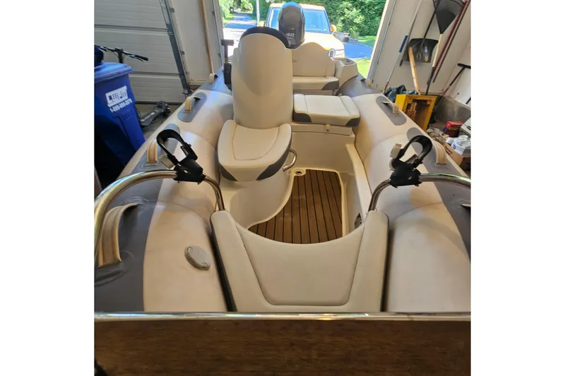 Slide: The Image of 2014 Zodiac Yachtline 2 Deluxe 380 inflatable boat interior in a garage setting. - 4