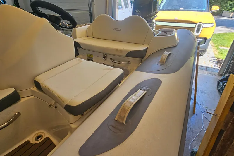 Slide: The Image of 2014 Zodiac Yachtline 2 Deluxe 380 inflatable boat interior with seating and steering wheel. - 8