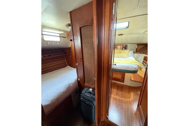 Slide: The Image of Interior of 1982 Lancer 45 Motorsailer with cozy wooden cabins and beds. - 16