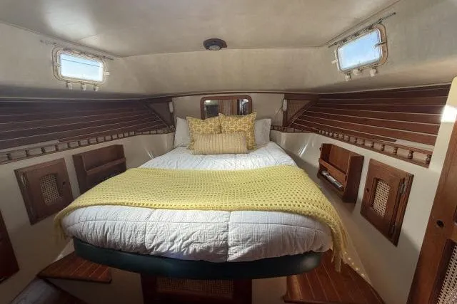 Slide: The Image of Cozy cabin interior of 1982 Lancer 45 Motorsailer with bed and wooden accents. - 18