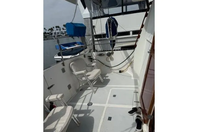Slide: The Image of 1982 Lancer 45 Motorsailer deck with chairs and nautical equipment. - 29