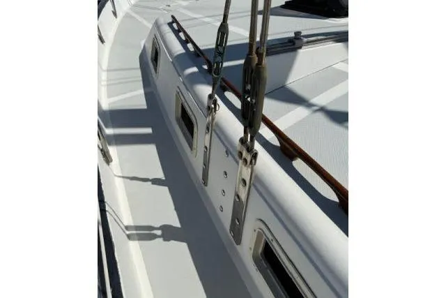 Slide: The Image of 1982 Lancer 45 Motorsailer deck with rigging and windows in sunlight. - 34