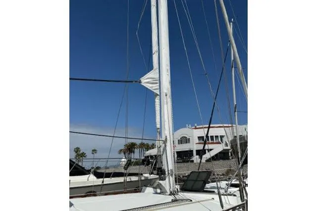 Slide: The Image of 1982 Lancer 45 Motorsailer mast and rigging against clear blue sky. - 35