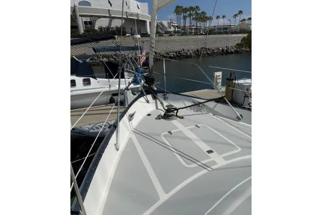 Slide: The Image of 1982 Lancer 45 Motorsailer docked, showcasing deck and rigging in a marina setting. - 39