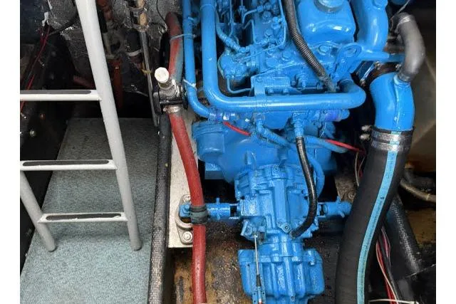 Slide: The Image of Engine compartment of a 1982 Lancer 45 Motorsailer with blue-painted engine components. - 45
