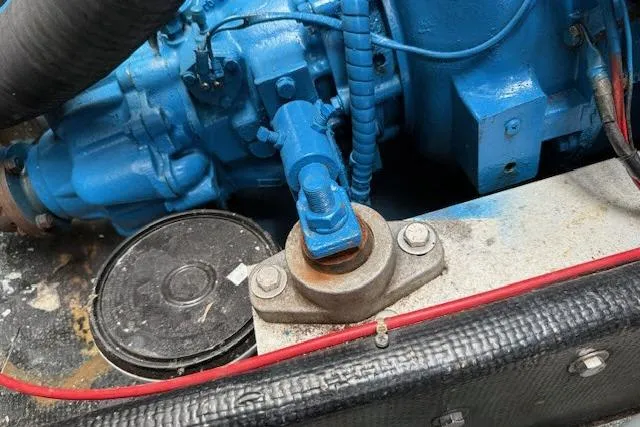 Slide: The Image of Engine component of a 1982 Lancer 45 Motorsailer, featuring blue machinery and red wiring. - 46