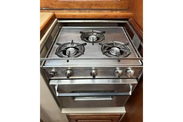 Slide: The Image of Stainless steel stove with three burners in a 1982 Lancer 45 Motorsailer kitchen. - 7