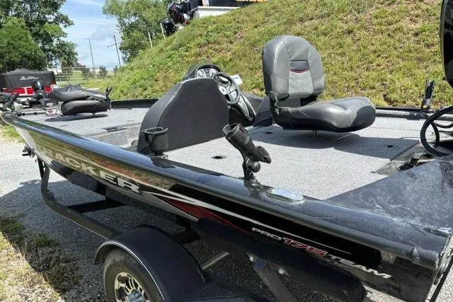 Slide: The Image of 2023 Tracker Pro Team 175 TXW fishing boat on trailer, featuring seating and steering console. - 15