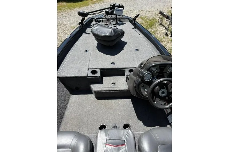 Slide: The Image of 2023 Tracker Pro Team 175 TXW boat interior with steering console and seating. - 3