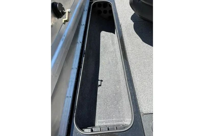 Slide: The Image of 2023 Tracker Pro Team 175 TXW boat storage compartment, open and empty. - 7
