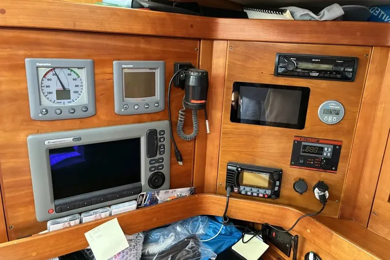 Slide: The Image of Control panel of a 1998 Sabre 36 yacht with navigation and communication equipment. - 14