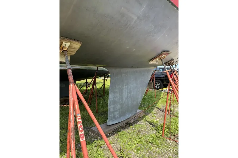 Slide: The Image of Keel of a 1998 Sabre 36 sailboat supported by red stands. - 15