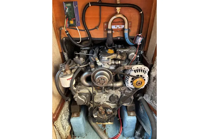 Slide: The Image of 1998 Sabre 36 engine compartment with Yanmar diesel engine and wiring. - 17