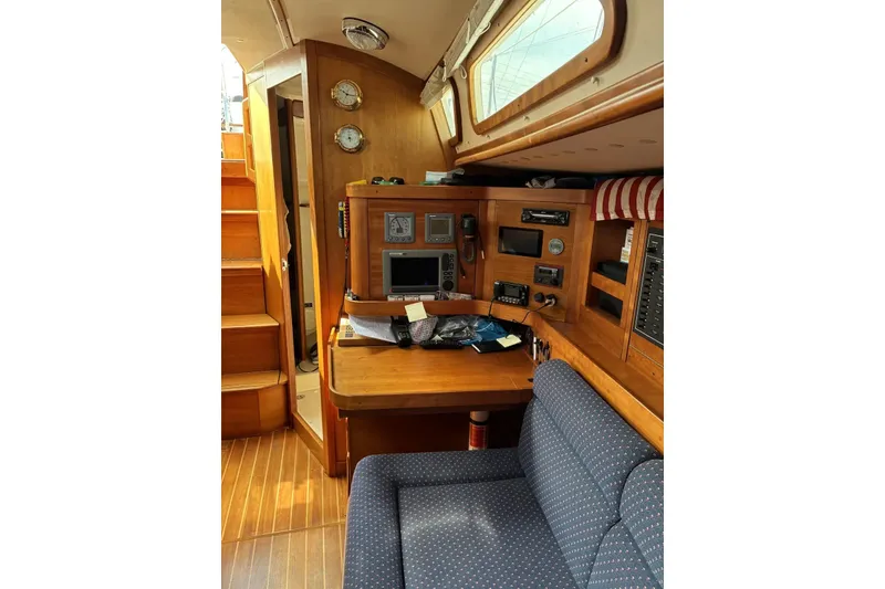 Slide: The Image of Interior of a 1998 Sabre 36 sailboat with navigation station and wooden cabinetry. - 3
