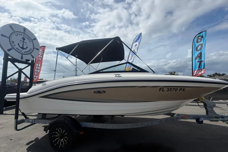 Slide: The Image of 2015 Sea Ray 19 SPX boat on trailer at sale display. - 1