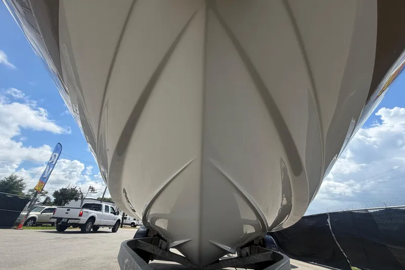 Slide: The Image of 2015 Sea Ray 19 SPX boat hull on trailer under blue sky. - 10