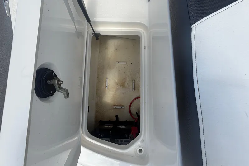 Slide: The Image of Battery compartment of a 2015 Sea Ray 19 SPX boat. - 14