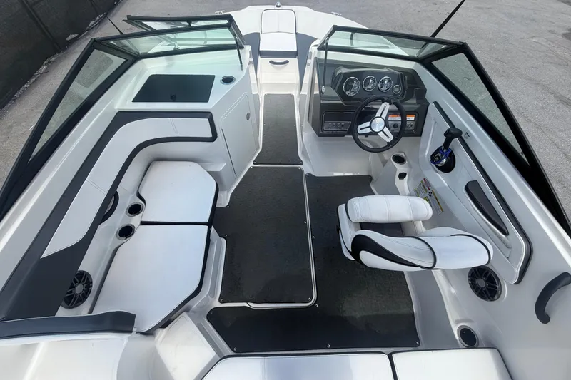Slide: The Image of Interior of a 2015 Sea Ray 19 SPX boat with helm station. - 16