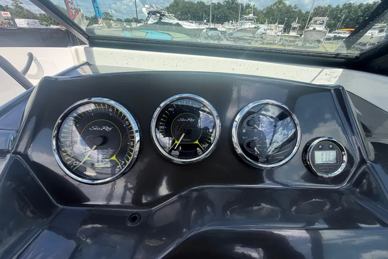 Slide: The Image of Dashboard of a 2015 Sea Ray 19 SPX boat with gauges and controls. - 21