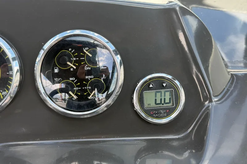 Slide: The Image of Dashboard of a 2015 Sea Ray 19 SPX boat with gauges and digital display. - 22