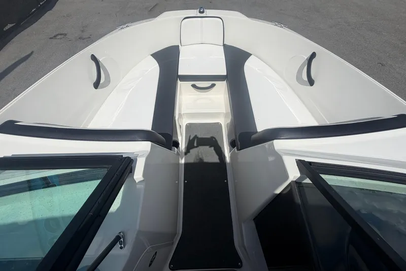Slide: The Image of 2015 Sea Ray 19 SPX boat interior with seating and open deck view. - 29