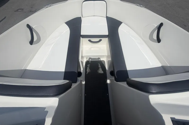 Slide: The Image of Interior view of a 2015 Sea Ray 19 SPX boat, featuring sleek seating design. - 30