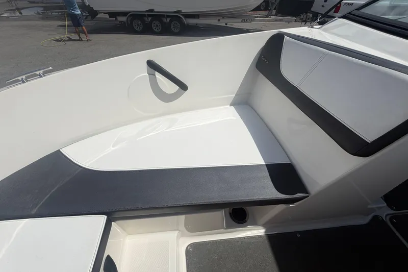 Slide: The Image of Interior seating of a 2015 Sea Ray 19 SPX boat, featuring sleek white and black design. - 31
