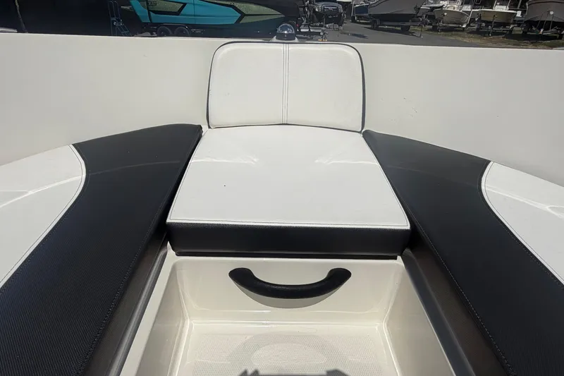 Slide: The Image of Interior seating of 2015 Sea Ray 19 SPX boat, featuring black and white upholstery. - 33