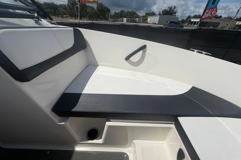 Slide: The Image of Interior seating of a 2015 Sea Ray 19 SPX boat, featuring sleek black and white design. - 34